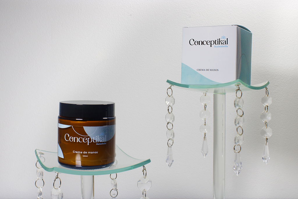 Fotografía de una crema de manos llamada "mainsbelle" de "conceptikal" mostrando el diseño del packaging